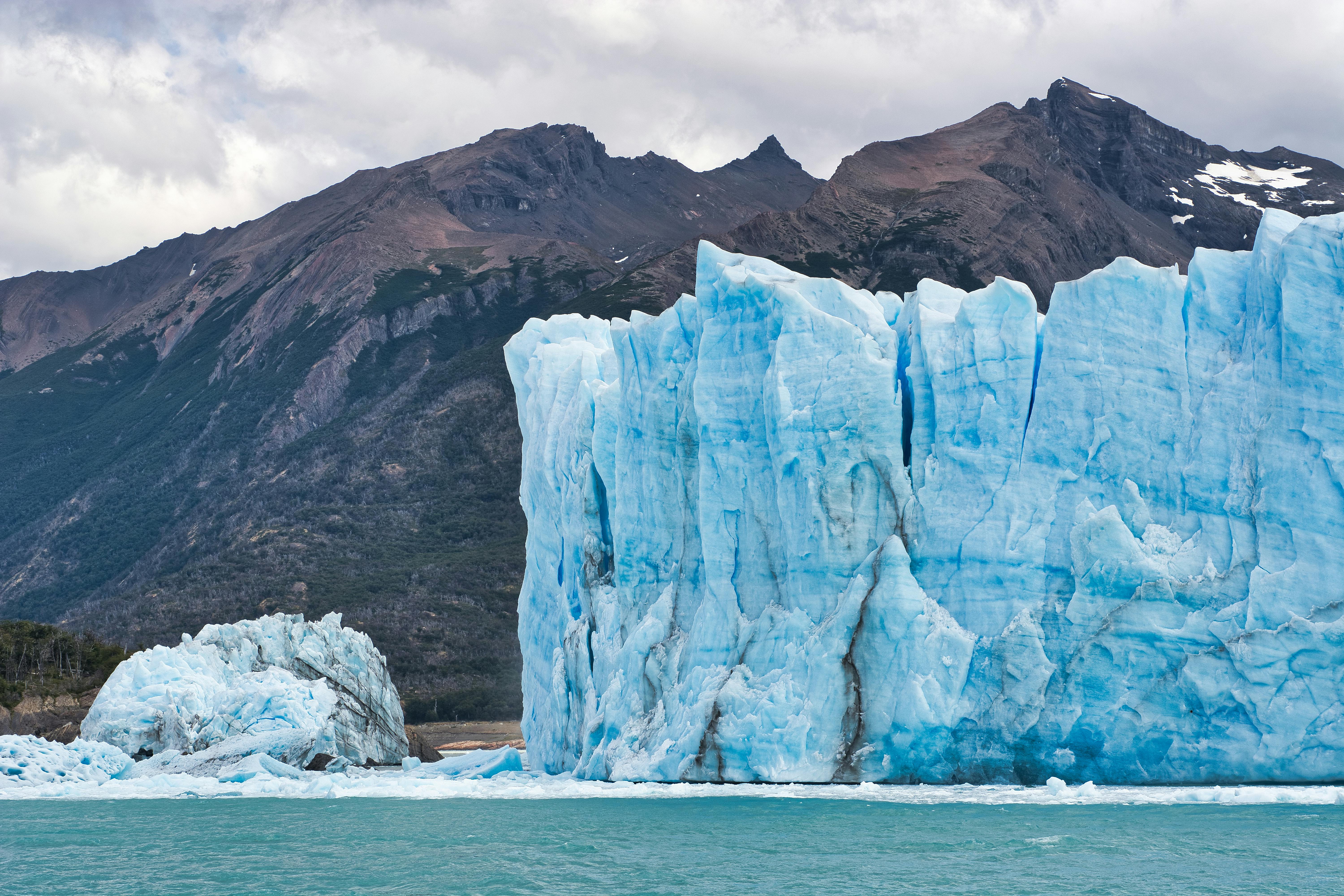 rough glacier in front of mountain in winter