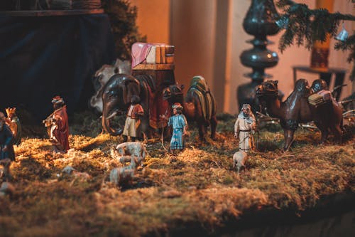 Nativity scene with miniature figurines of people demonstrating Birth of Christ placed in church