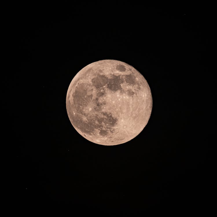 Full Spotted Moon In Black Sky At Night