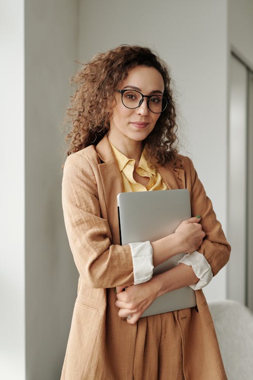 Woman Holding a Laptop
