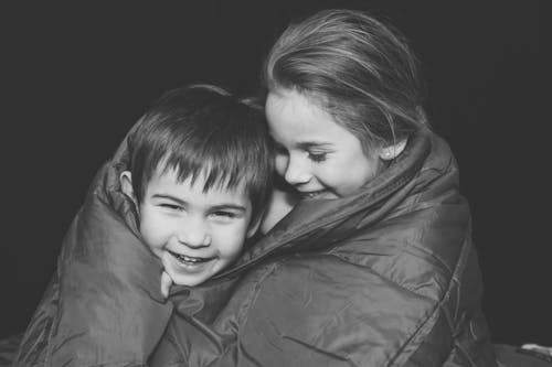 Grayscale Photography of Children Smiling