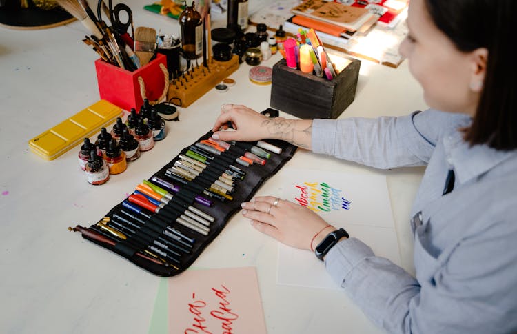 Photo Of Woman Holding Brush Pen