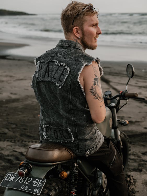 Photo of Man Sitting on His Motorcycle