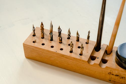Calligraphy Tools on Brown Wooden Case