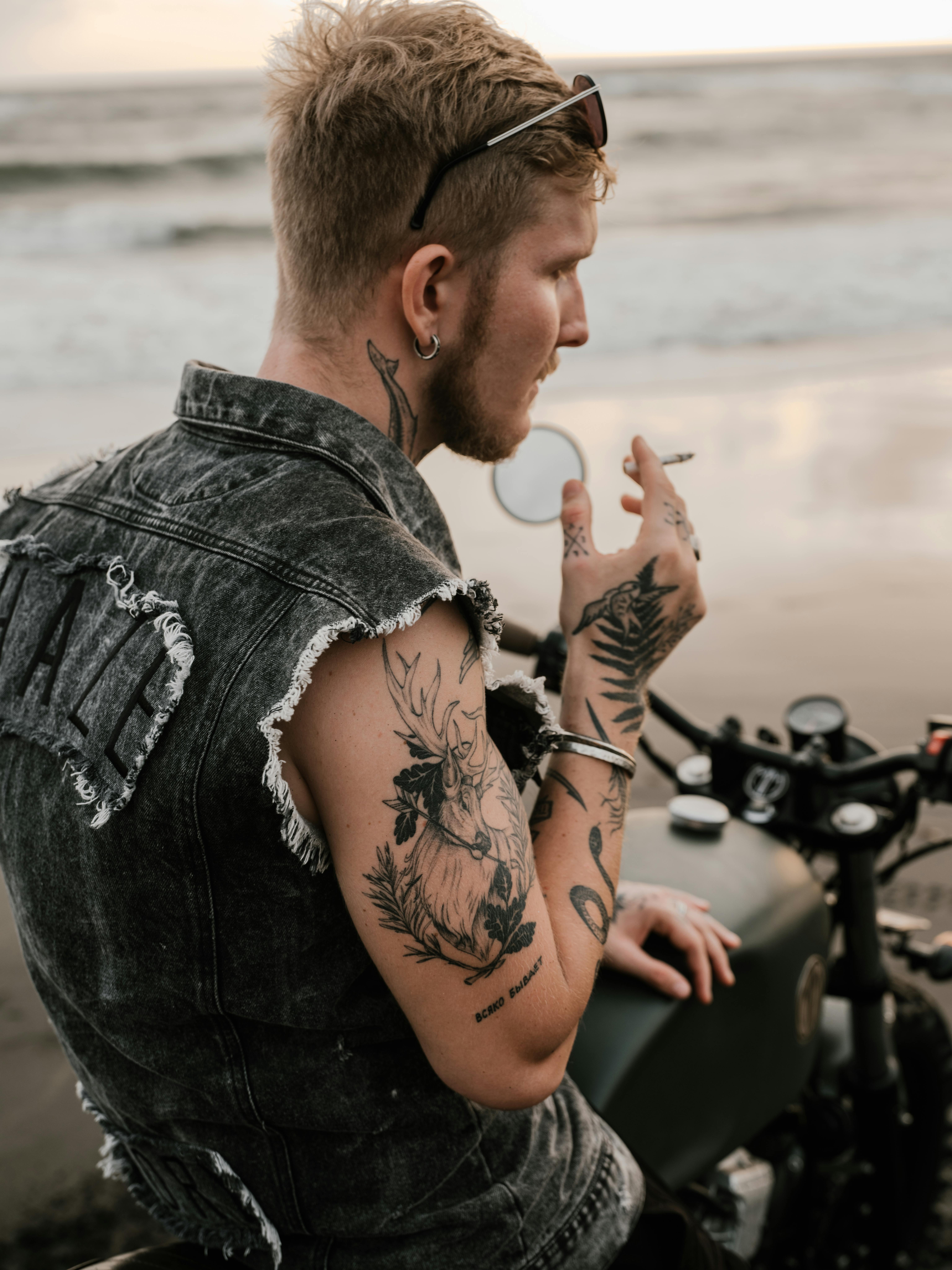 Close Up Portrait Of An Attractive Thoughtful Tattooed And Bearded Man  Stock Photo - Download Image Now - iStock