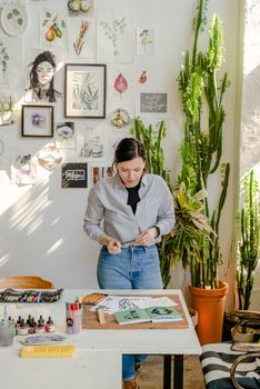 Photo Of Woman Looking At Her Works 