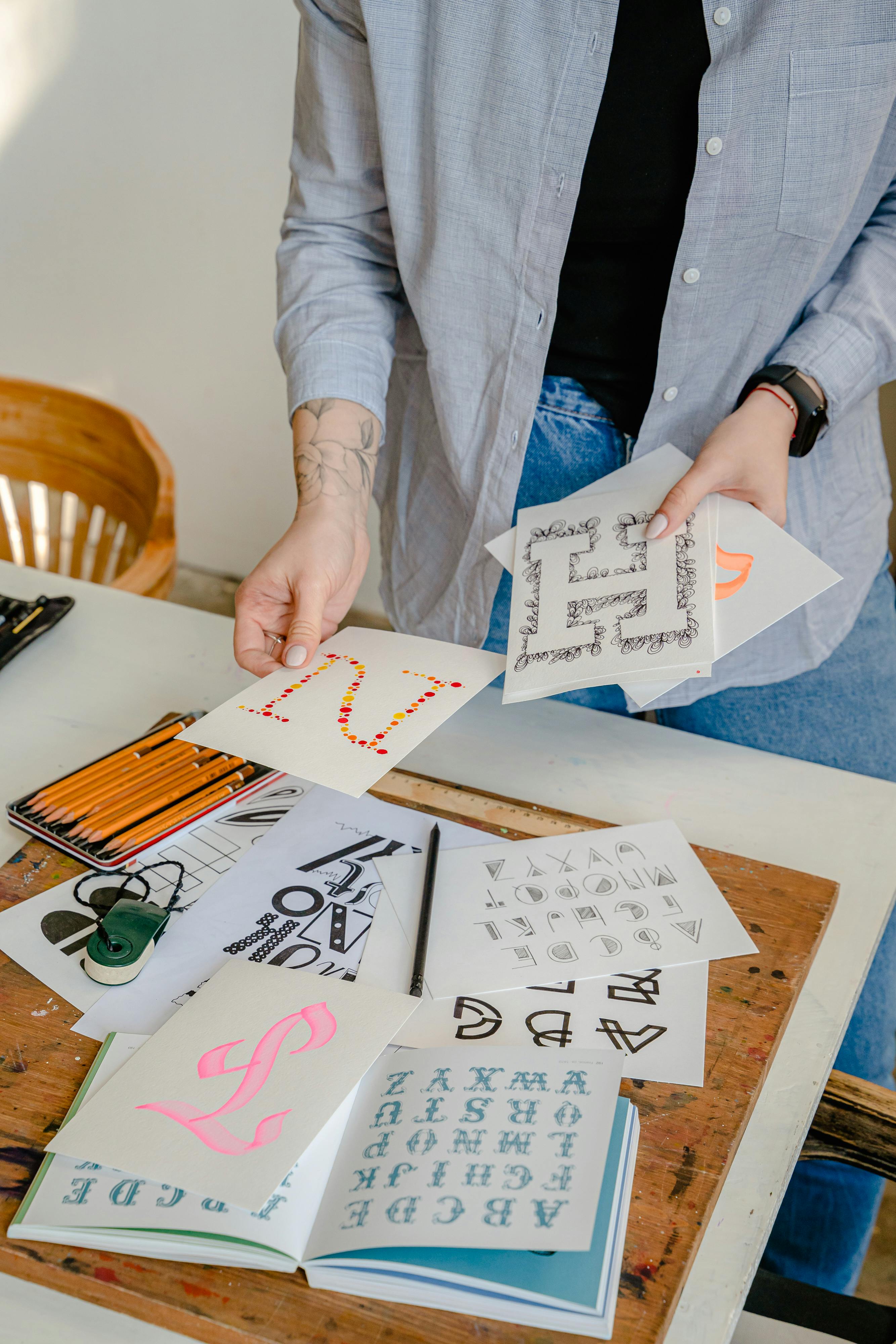 woman holding calligraphy project