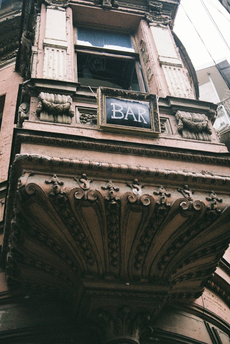 Facade Of Old Building With BAR Inscription In Daylight