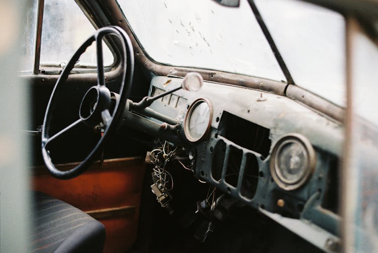 Interior Of Retro Car With Speedometer And Steering Wheel