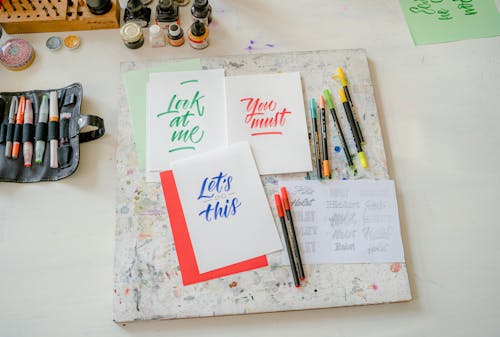 Colorful Pens and Lettering on Paper