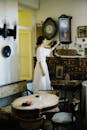 Woman in dress checking time at clock