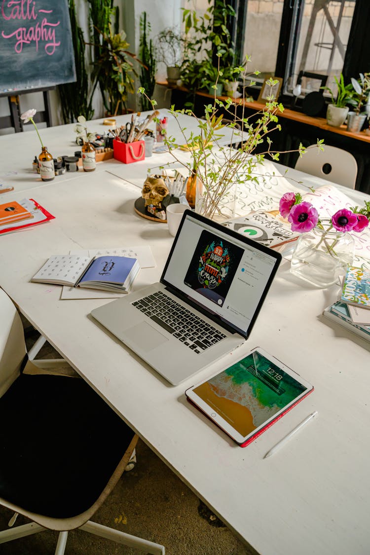 Laptop And A Tablet On White Wooden Table