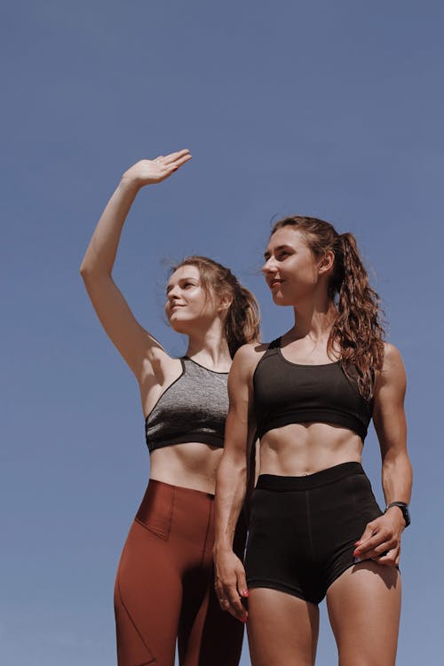 Women Standing Together Wearing Fitness Wear