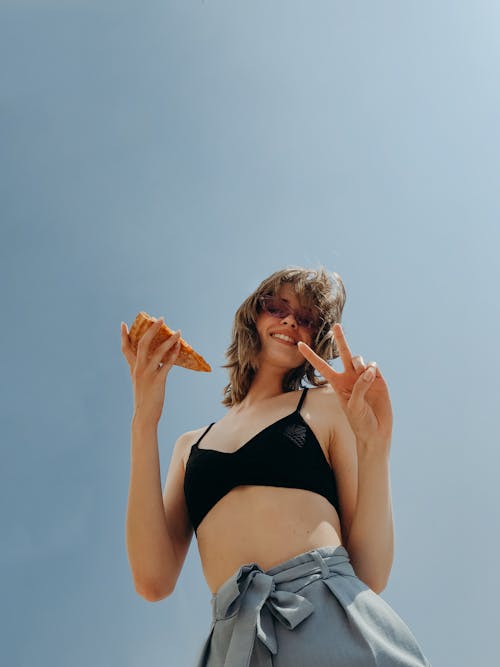 Low Angle Shot of Woman Black Tank Top 