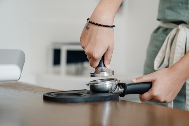 Crop Barista Working With Tamper And Coffee Machine Holder