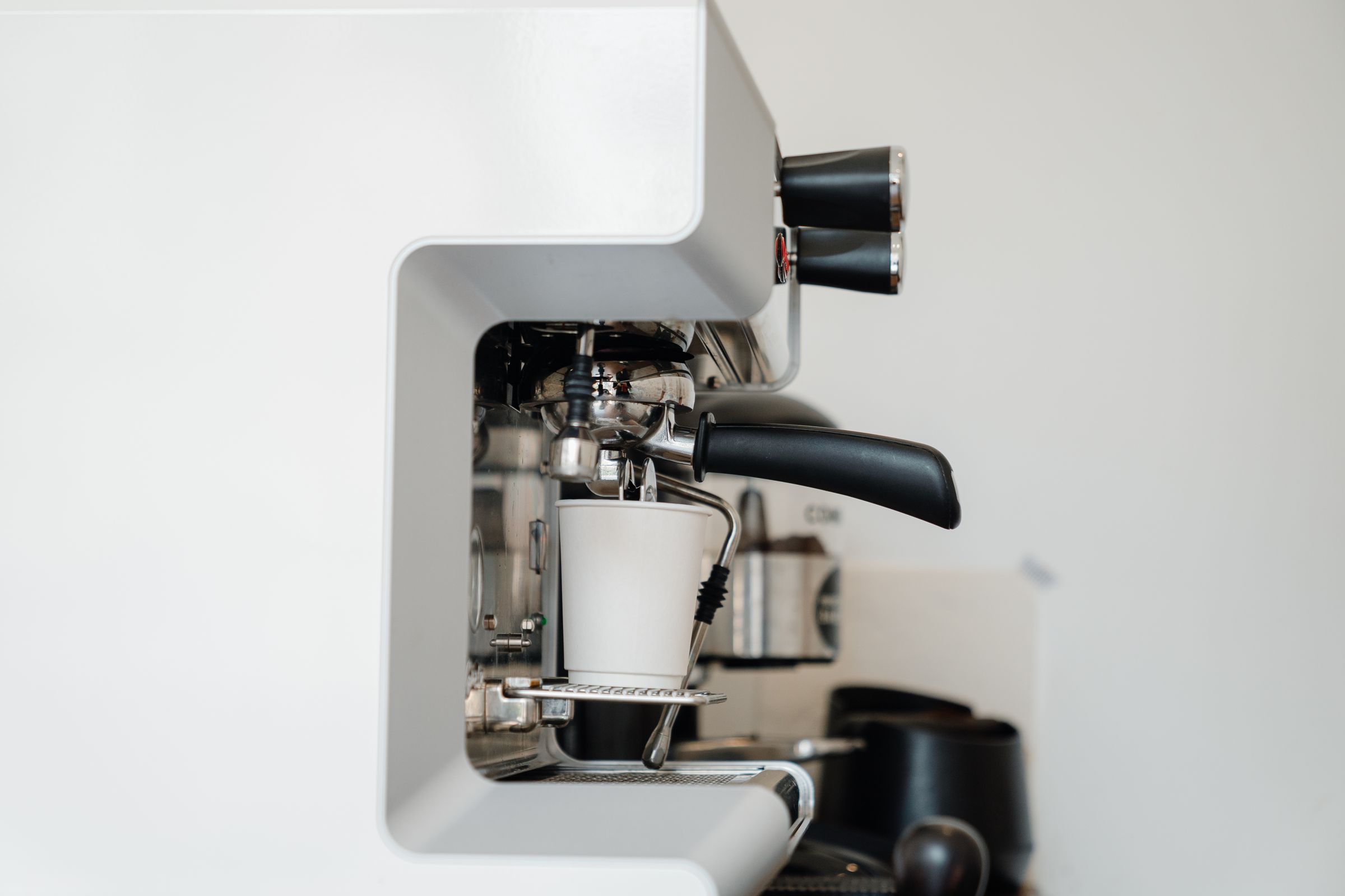 An espresso machine photographed against a plain white background