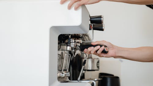 Person Using Espresso Machine
