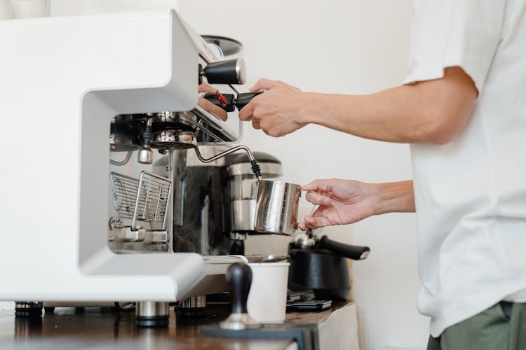 Person Using Espresso Machine