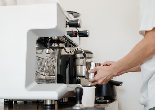 Free Person Using Espresso Machine Stock Photo