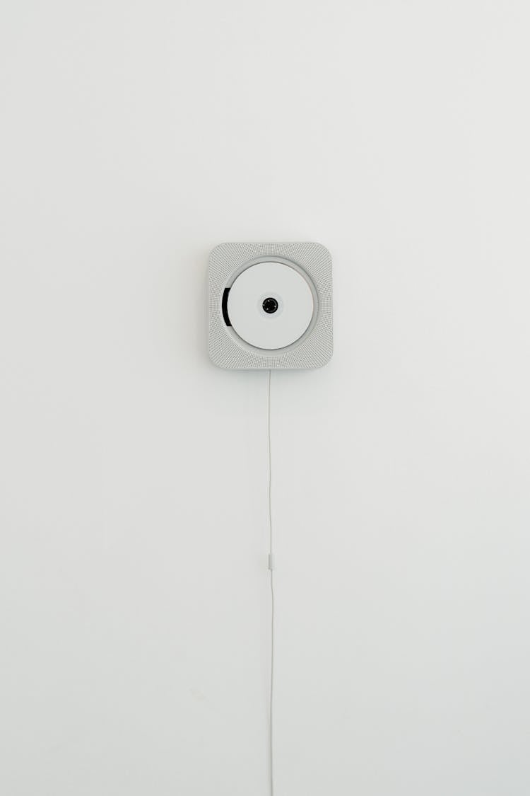 White Wall Mounted CD Player Against White Wall