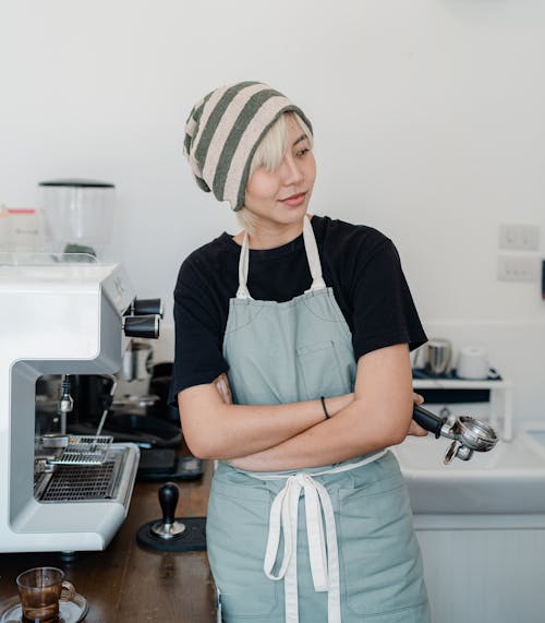 Free Photo of Woman Standing Near Coffee Machine Stock Photo