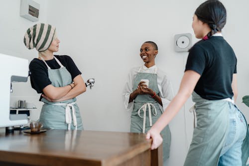 Free Photo of Three Women Standing While Talking to Each Other Stock Photo