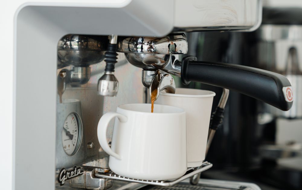 Fresh coffee being poured into a diner mug