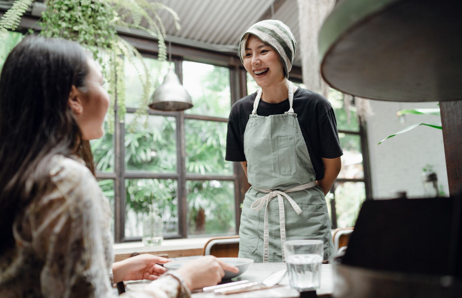 Cheerful waitress serving guests