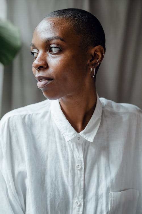Content black woman in white blouse
