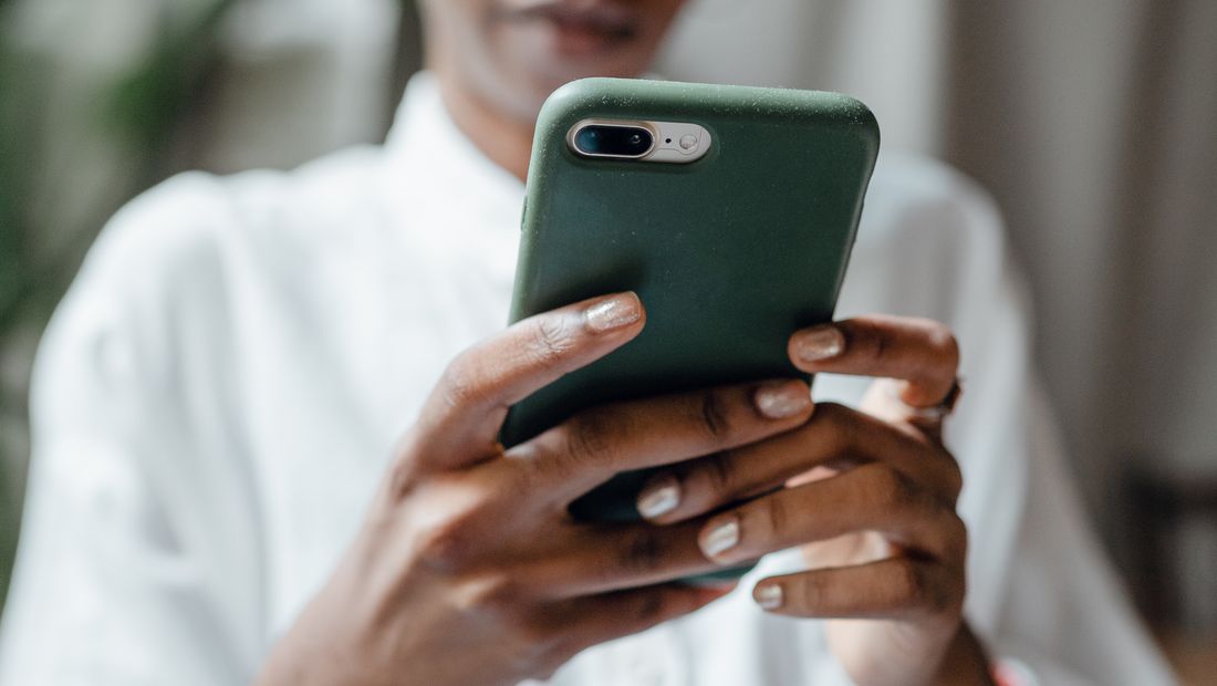 A customer making a call on a smartphone
