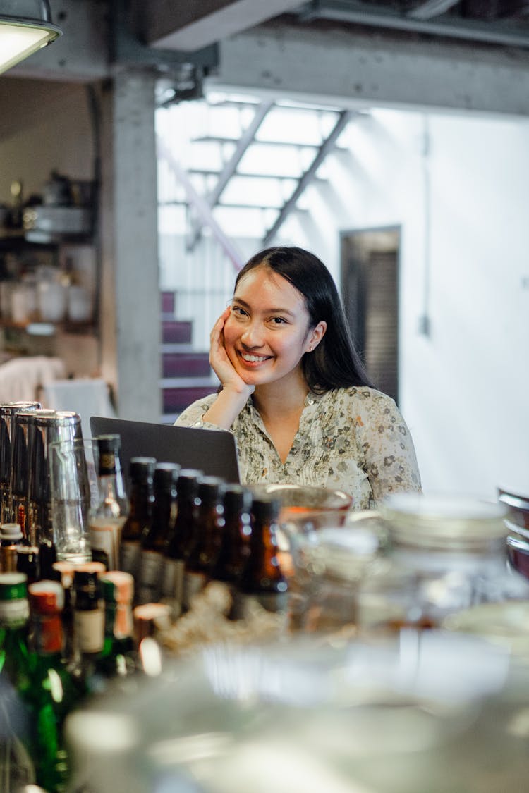 Joyful Young Asian Female Relaxing In Bar