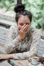 Cheerful woman having fun with friends in cafe