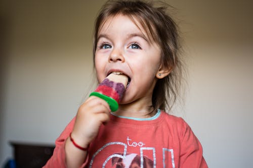 Girl Eating Popsicle