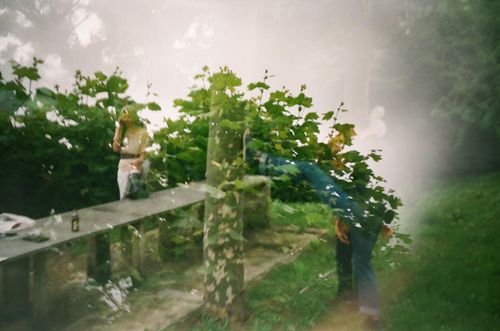 Free Artistic double exposure captures people and nature in Saint-Sébastien, creating a layered reflection in the park. Stock Photo