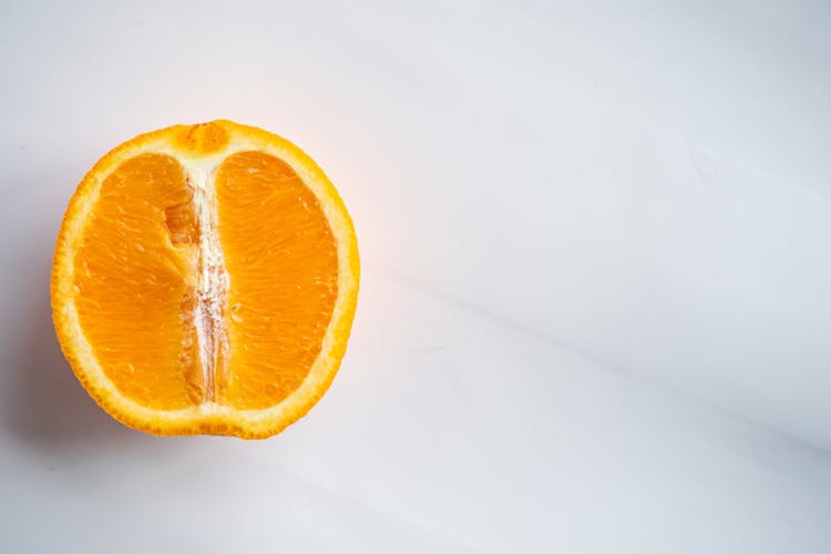 Colorful Juicy Half Orange On White Background