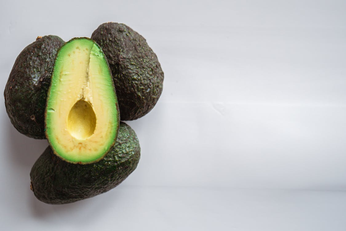fresh avocados with rough dry skin as one of the ways to get glowing skin in 24 hours