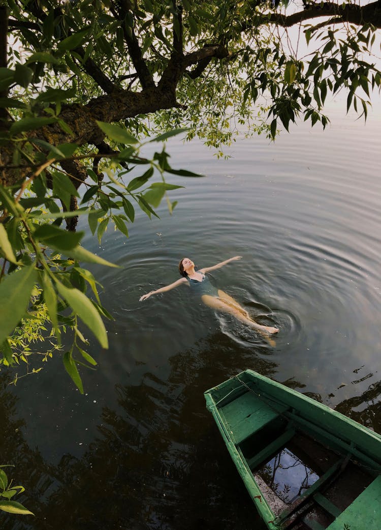 Woman Swimming On A Lake