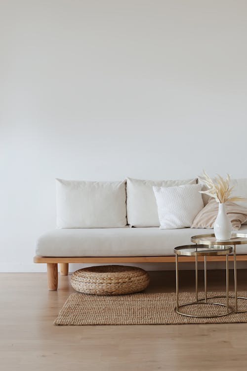 Free White Couch on Wooden Floor Stock Photo