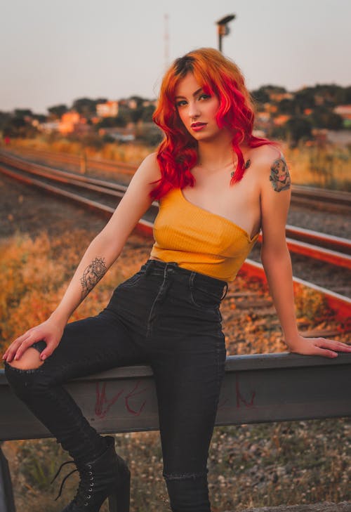 Sensual young woman chilling near railway station