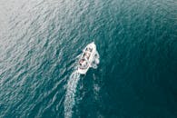 Modern motorboat floating in rippling sea