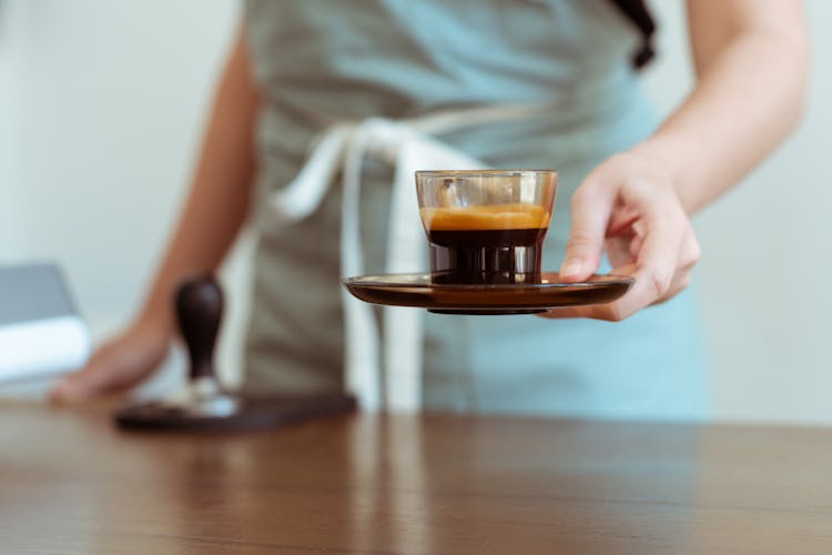 Crop Barista With Fresh Black Coffee Ready For Customer