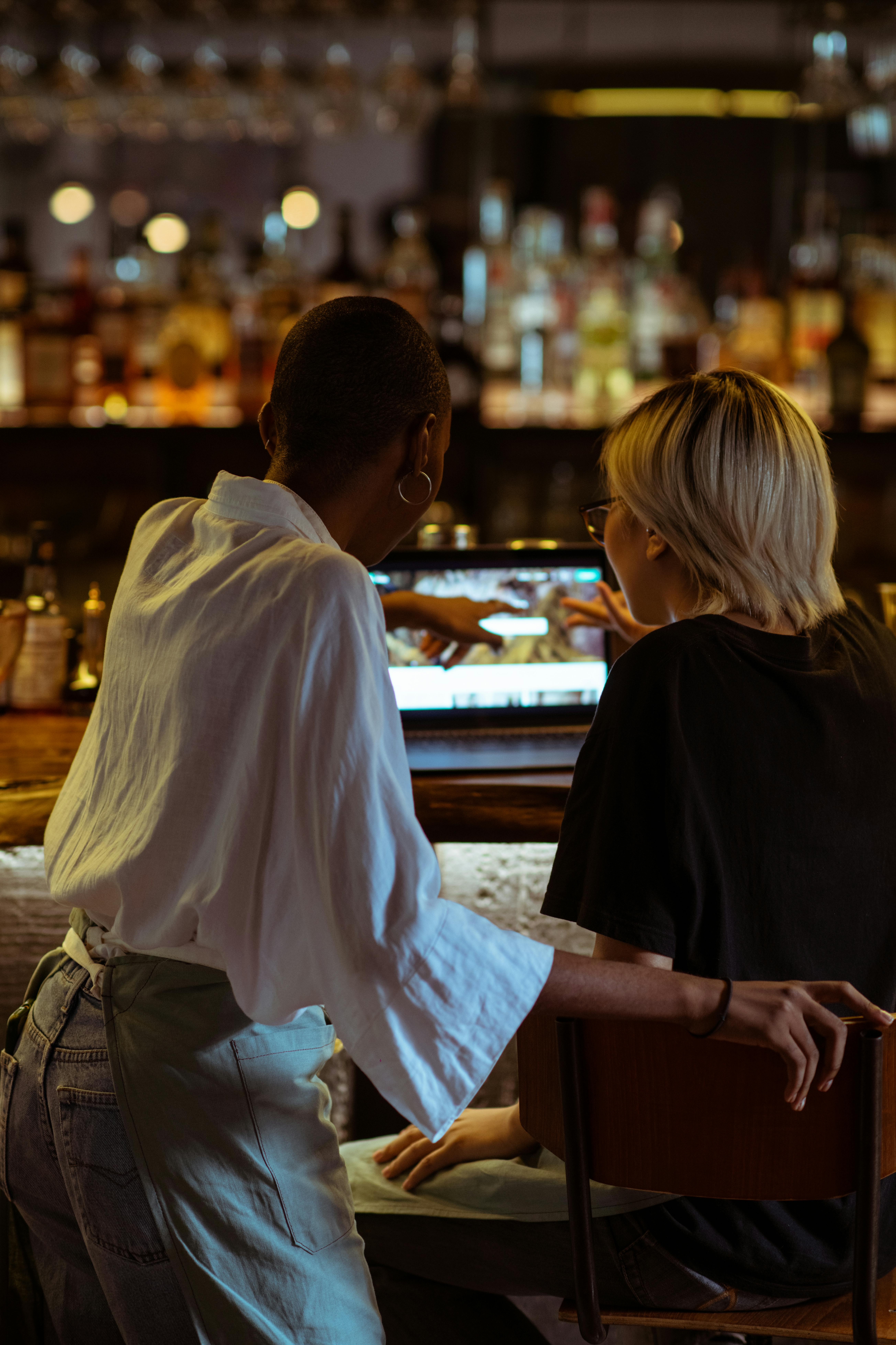 Coworking cafe workers using laptop · Free Stock Photo