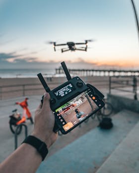 Drone piloting at a Los Angeles beach during sunset, capturing vibrant outdoor moments.
