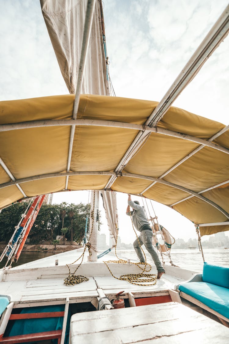 Unrecognizable Sailor Man Working On Boat Deck