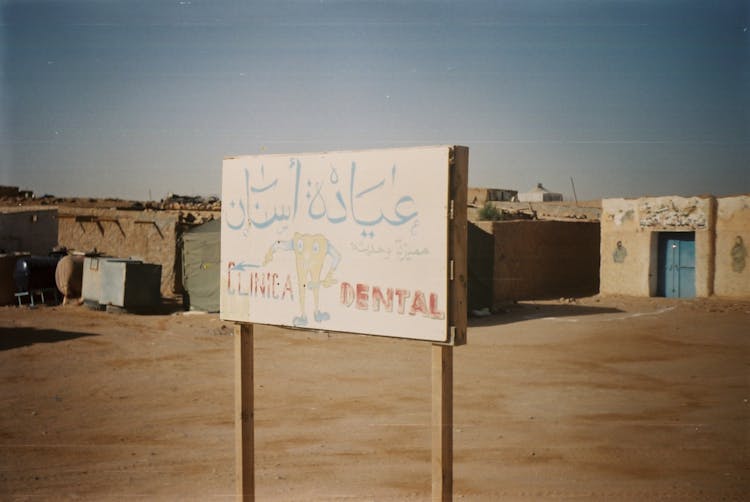 Weathered Dentist Sign In Desert Village