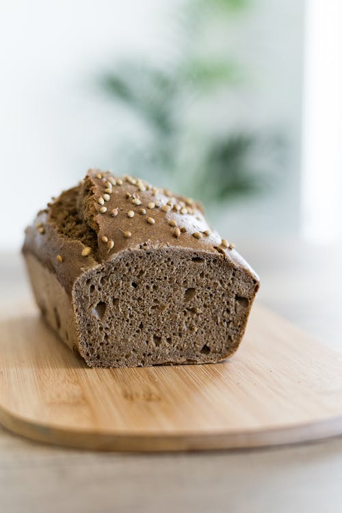 Free Brown Bread on Brown Wooden Table Stock Photo
