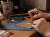 Person Painting on White Paper