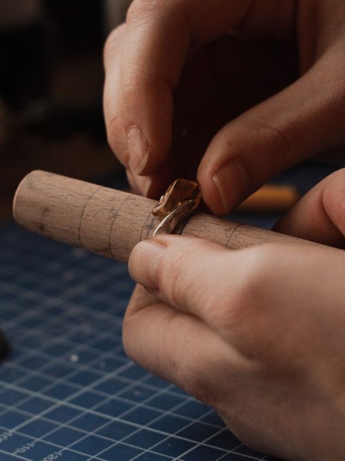 Free Detailed view of hands crafting a wooden ring. Perfect for artisan and craft concepts. Stock Photo