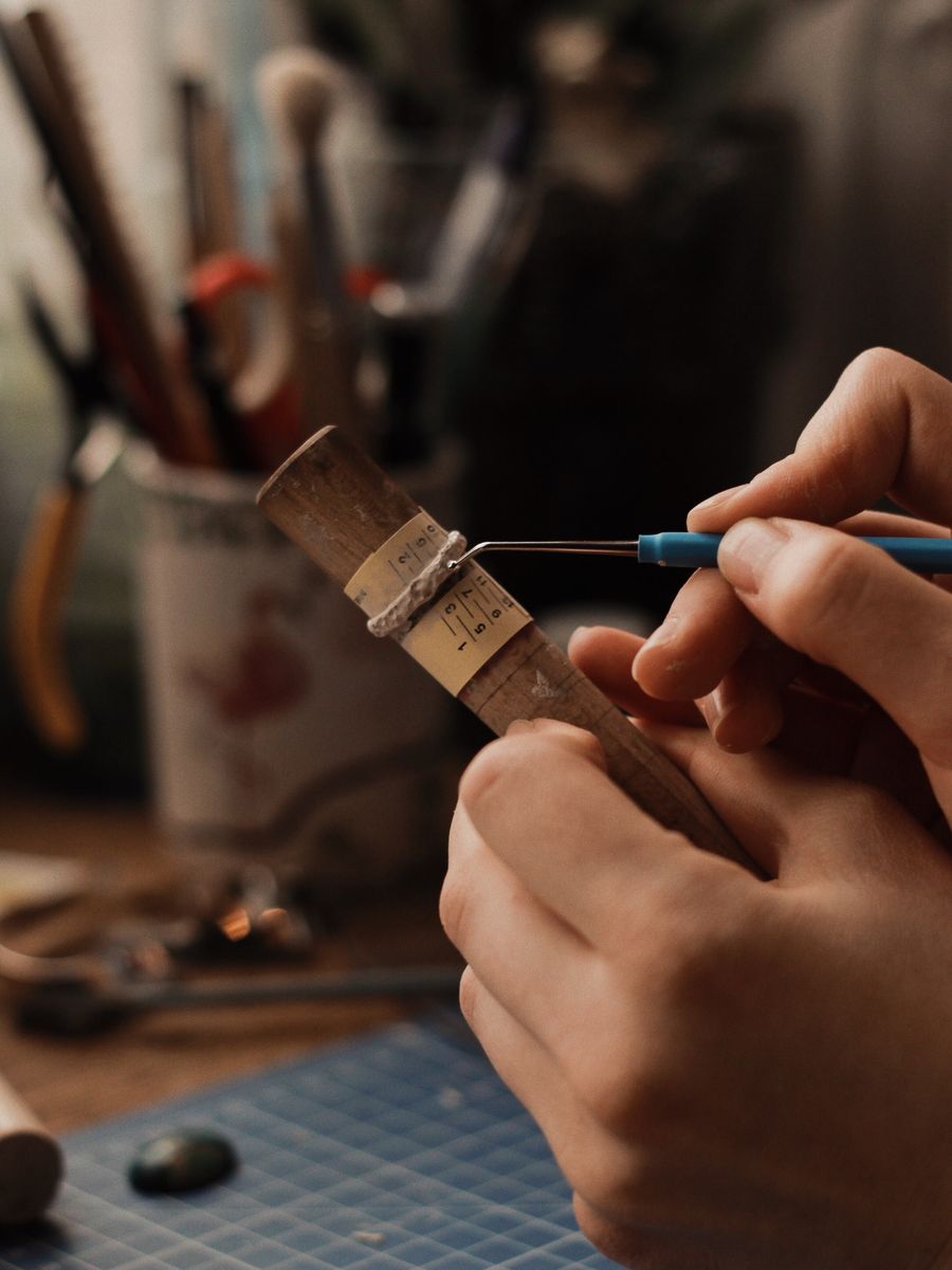 Artisan jeweler crafting a silver ring