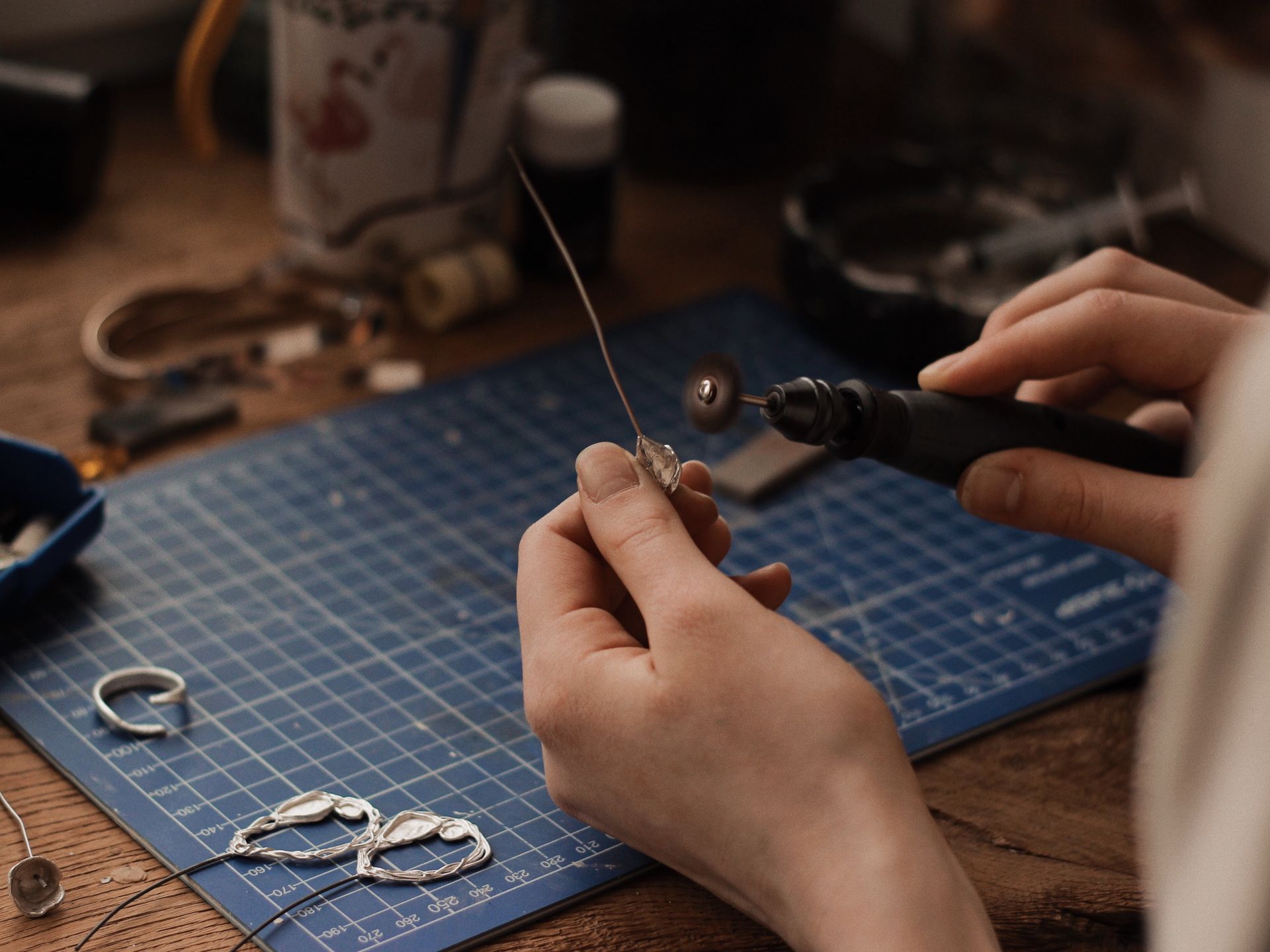 Hands of a Person Polishing a Silver Object